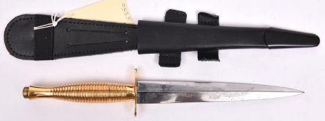 A D-Day 50th Anniversary commemorative FS fighting knife, etched blade, in its scabbard. VGC £70-80