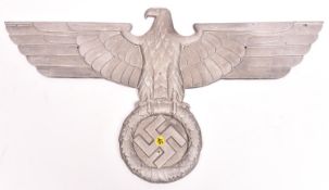 A Third Reich cast aluminium alloy wall eagle, wingspan 28¾” (73cm), the back marked “GAL Mg-Si