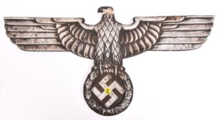 A Third Reich cast aluminium alloy wall eagle, wingspan 27" (69cm), the back bearing maker’s mark “