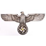 A Third Reich cast aluminium alloy wall eagle, wingspan 27" (69cm), the back bearing maker’s mark “