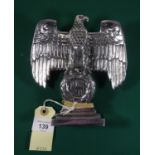 A Third Reich polished cast aluminium desk eagle, with integral rectangular base and threaded hole