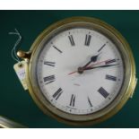 A brass cased ship’s clock, white face, 8" diameter of case. GC (not known if working) £20-25.