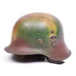 A Third Reich M43 raw edge steel helmet, camouflage finish, single decal. GC £100-120.