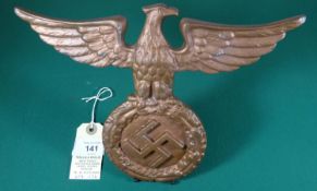 A Third Reich small cast brass wall (or desk) eagle, 9¼” x7½” (23.5x19cm), with rear hinge type