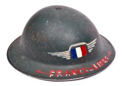 A WWII British army steel helmet, with “France Libre” and tricolour added in red, white and blue