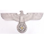 A Third Reich cast aluminium alloy wall eagle, wingspan 27" (69cm), the back bearing maker’s mark “