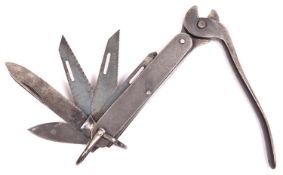 A scarce SOE escape knife, incorporating folding 3” knife blade, gouge and 3 saw blades, wire cutter