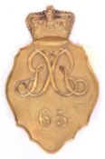 An officer’s shako plate, 1812 pattern, of the 65th Regiment, “65” below interlaced “GR”. Very