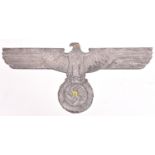 A Third Reich cast aluminium alloy wall eagle, wingspan 35" (89cm), the back marked “...Mg.si APAG”,