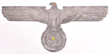 A Third Reich cast aluminium alloy wall eagle, wingspan 35" (89cm), the back marked “...Mg.si APAG”,