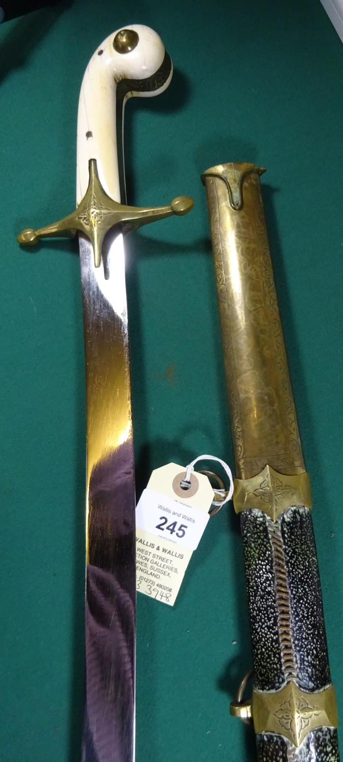 A 19th century mameluke hilted sword, plain , curved, flat blade 33", brass crossguard with bud