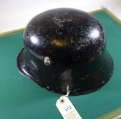 The skull only of a re-enactment German M16 helmet, of heavy cast aluminium, with black painted