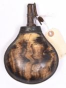 A mid 18th century brass mounted bulbous cow horn powder flask, 7" overall, the top with foliate