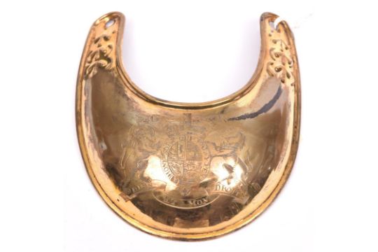 A large early pattern gilt gorget of George III, engraved with the Royal Arms. Good Condition