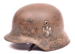 A Third Reich M35 single decal steel helmet, with maker’s mark and size “ET62” (Eisenhuttenwerke),