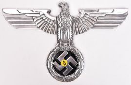 A Third Reich polished cast aluminium wall eagle, wingspan 15" (38cm), the back with small