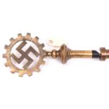 A Third Reich DAF (Deutsche Arbeitsfront) swastika in cogwheel brass standard top, mounted on a