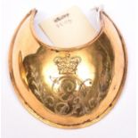 A George III officer’s gilt gorget, engraved with the Royal cypher, with chamois liner. Very Good