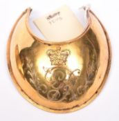 A George III officer’s gilt gorget, engraved with the Royal cypher, with chamois liner. Very Good