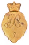 An officer’s shako plate, 1812 pattern, of the 7th Regiment, interlaced “GR” with “7” below. Very