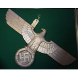 A Third Reich cast aluminium alloy wall eagle, wingspan 27" (69cm) the back bearing maker’s mark “