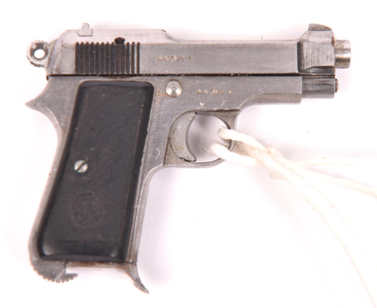 A finely crafted non working miniature Italian Model 1934 Beretta automatic pistol, 1-5/8"