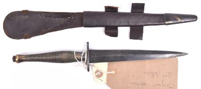 A WWII 2nd Pattern FS fighting knife, blued blade, hatched bronze hilt, in its scabbard. GC Plate 30