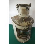 A mast head type stern lamp, steel body, also a small model ship in a bottle. GC £30-40.