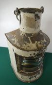 A mast head type stern lamp, steel body, also a small model ship in a bottle. GC £30-40.