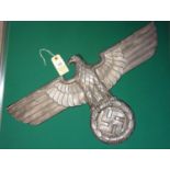 A Third Reich cast aluminium alloy wall eagle, wingspan 23" (59cm), the back with embossed RZM
