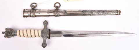 A Third Reich late war Naval officer’s dagger, with unmarked blade, grey metal hilt mounts and
