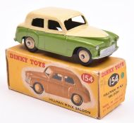 Dinky Toys Hillman Minx Saloon (154). An example in cream and light green, with cream wheels and