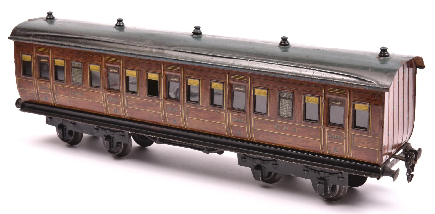 A Marklin Gauge One bogie passenger coach. A G.N.R. example in lined teak effect livery, RN 2875.