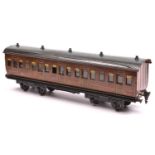 A Marklin Gauge One bogie passenger coach. A G.N.R. example in lined teak effect livery, RN 2875.