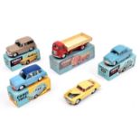 5 Corgi Toys. Aston Martin DB4 in yellow with red interior. Austin Cambridge in light blue. Austin