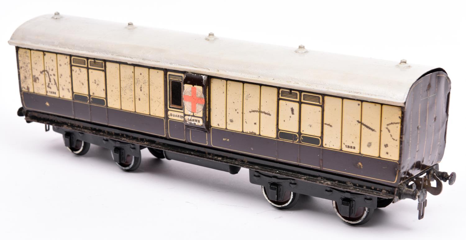 A Gauge One railway Carette LNWR Full Brake bogie van. 1332, in lined chocolate and cream livery