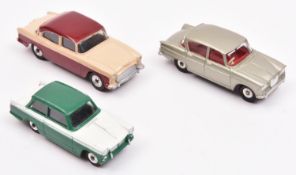 3 Dinky Toys. Humber Hawk (165), in cream with maroon roof and lower sides. A Singer Vogue (145), in