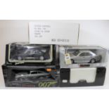 5 1:18 scale cars. A UT Models Mercedes-Benz C36 AMG in silver. An AUTOart 'Goldfinger 007' Aston-