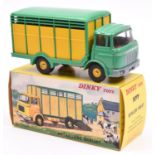 French Dinky Toys Betaillere Berliet (577). In mid green and yellow livery. Complete with 2 cows.
