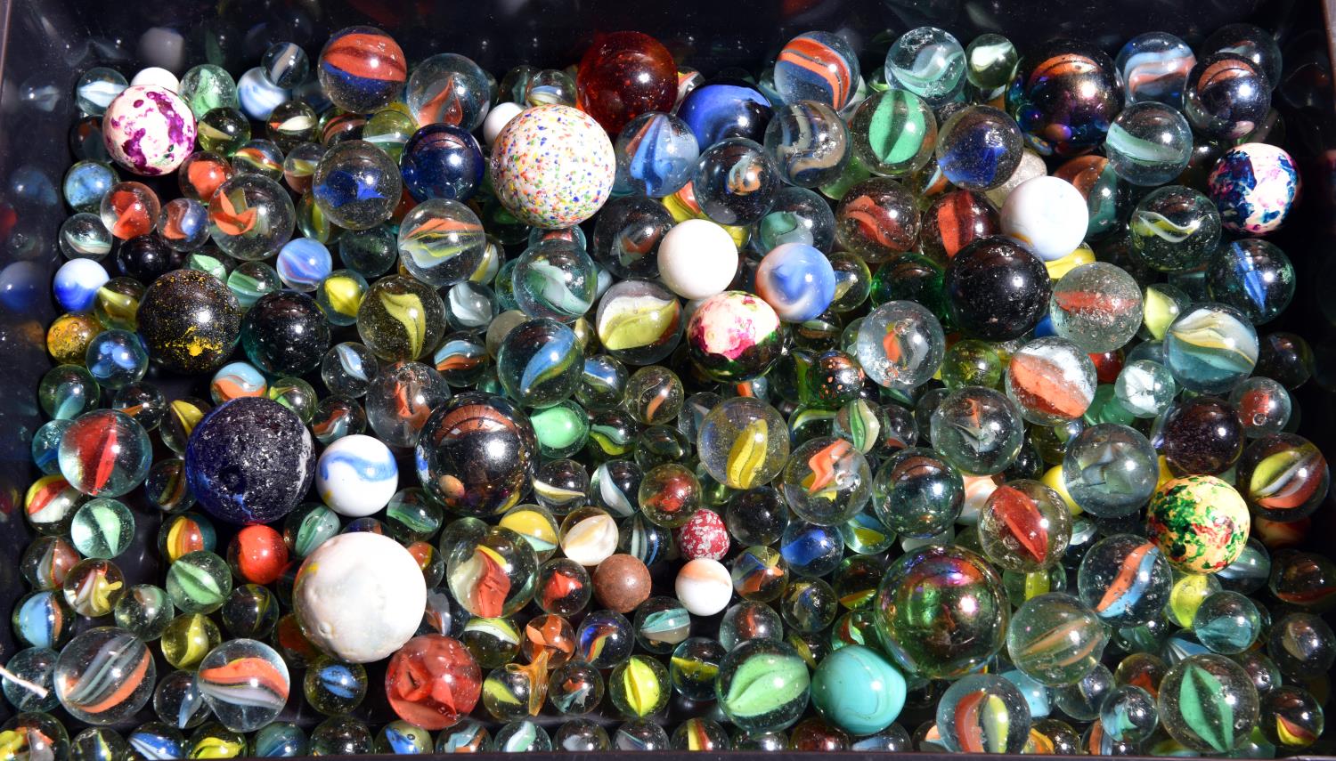 An impressive old collection of 300 plus glass marbles. Various sizes including many small plus a