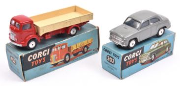 2 Corgi Toys A Morris Cowley Saloon (202). An example in light grey with smooth spun wheels and