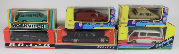 6 Russian produced 1:43 scale vehicles. A ZIL-117 Limousine. A Minibus style Ambulance, with blue