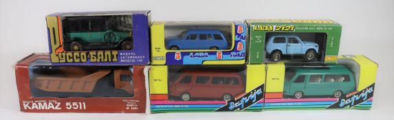 6 Russian produced 1:43 scale vehicles. A Kamaz 5511 Heavy Duty Truck. A Lada 121 Hatchback. 2x