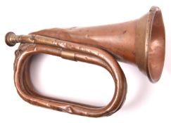 A WWII British army copper bugle, marked “21 PTC Besson & Co, London 1940” and broad arrow. GC (