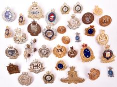 17 EIIR New Zealand badges, including Officer’s gilt cap badges of the 9th, 15th and 12th/13th