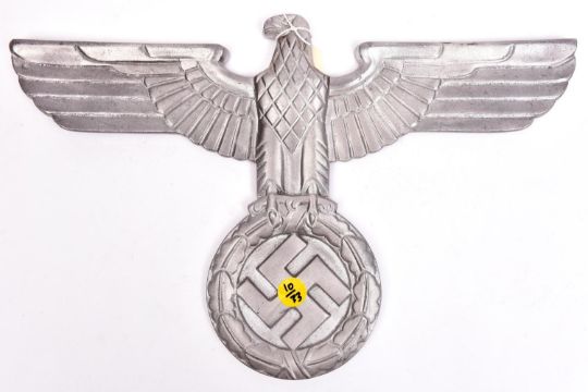 A Third Reich cast aluminium wall eagle, wingspan 15" (38cm), with no means of mounting GC Not