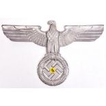 A Third Reich cast aluminium wall eagle, wingspan 15" (38cm), with no means of mounting GC Not