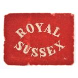 A scarce FS helmet or slouch hat rectangular patch of the Royal Sussex Regiment, Boer War or WWI