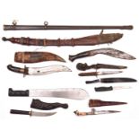 A Gurkha kukri; a West African sword in sheath; a machete, 5 other knives and a Vic sword