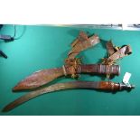 A Sudanese sword, SE curved blade 24½”, with very faint central ridge, polished leather grip with